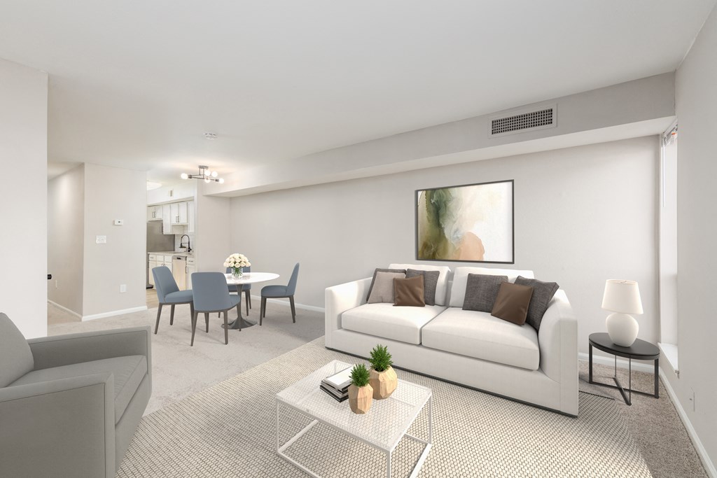 a living room with a white couch and a table