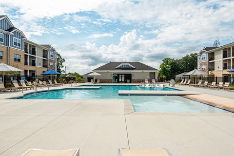 the preserve at ballantyne commons swimming pool with apartment buildings