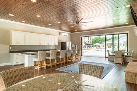 a large living room with a kitchen and a dining table