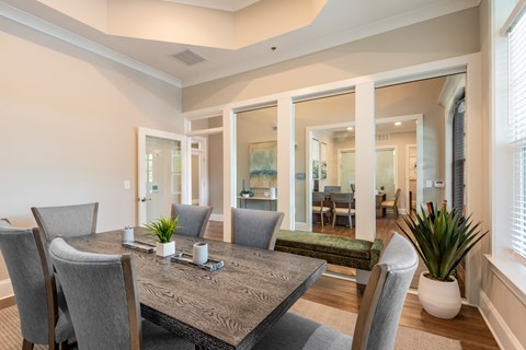 a dining room with a table and chairs