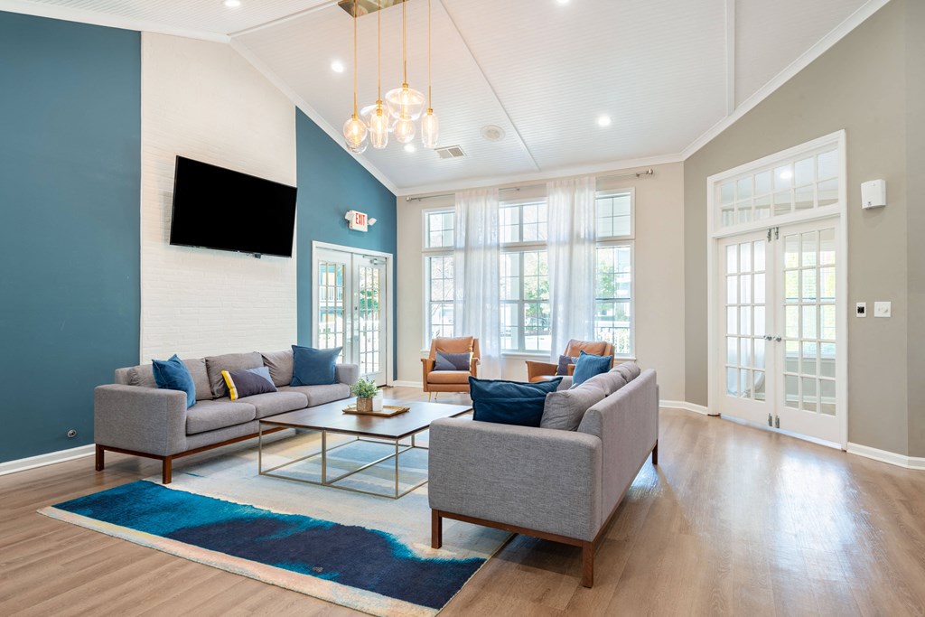 a living room with couches chairs and a coffee table