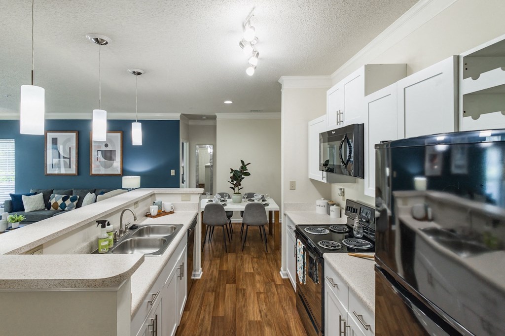 a kitchen and dining area in a 555 waverly unit