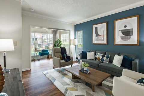 a living room with blue walls and a couch and a coffee table