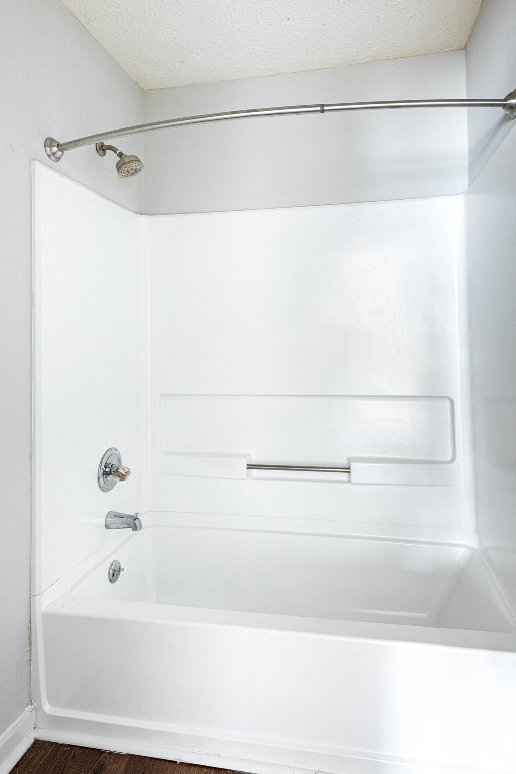 a white bathroom with a shower and a tub