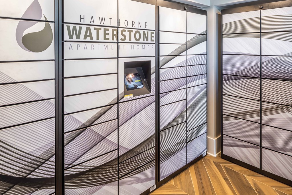 a view of a lobby with glass walls and a tv on the wall