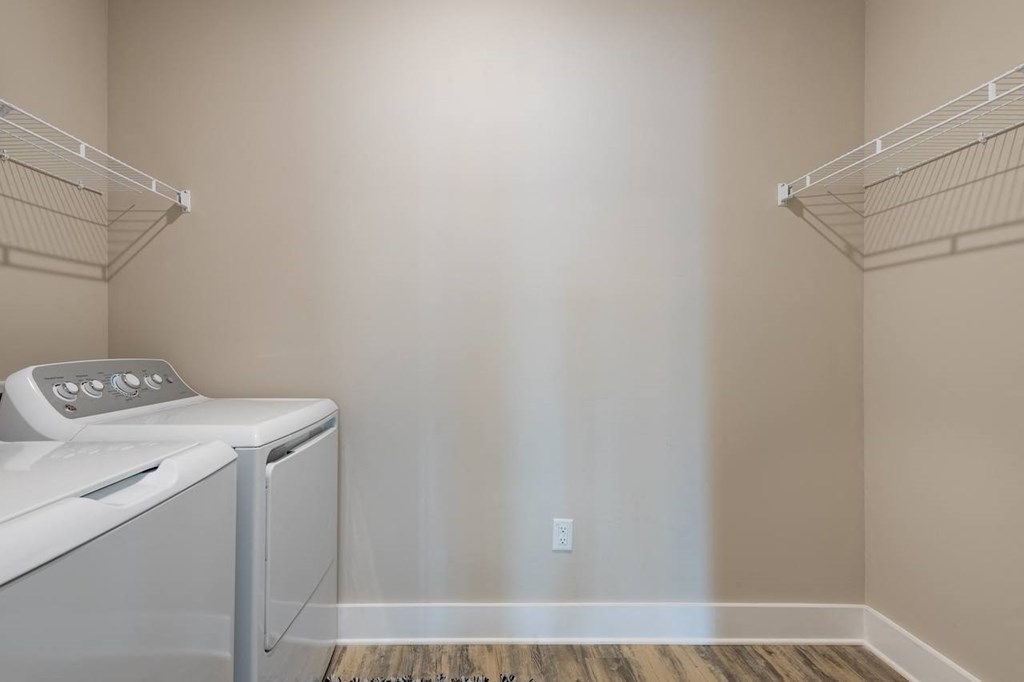 a laundry room with a washer and dryer