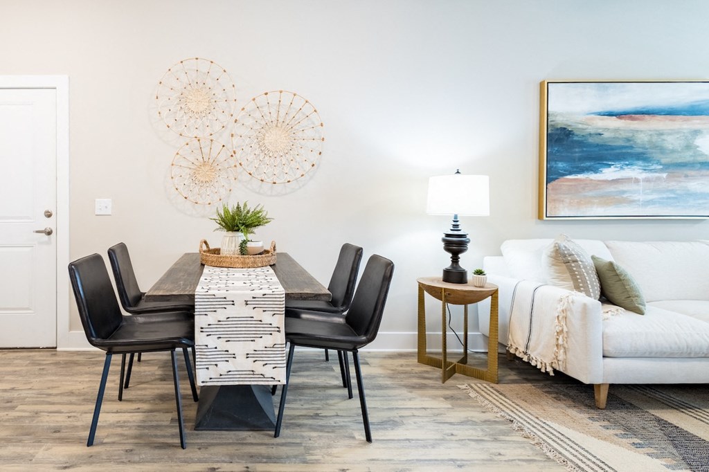 a dining room with a table and chairs
