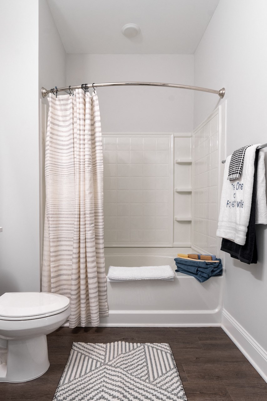 a small bathroom with a shower and a toilet