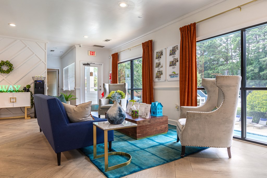 a living room with couches and chairs and a coffee table