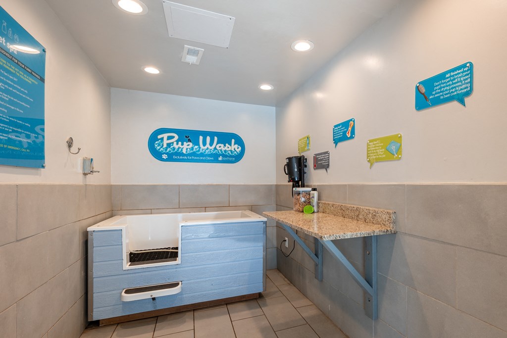a kitchen with a sink and a counter top in a hotel room
