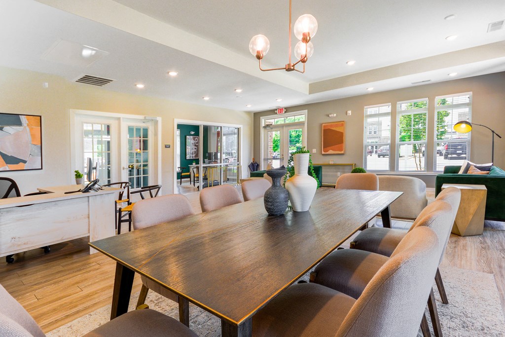 a dining room with a wooden table and chairs