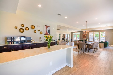 a large kitchen and dining room with a table and chairs