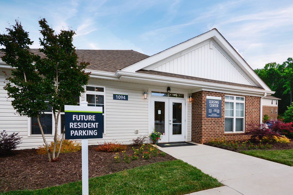 a house with a future resident parking sign in front of it