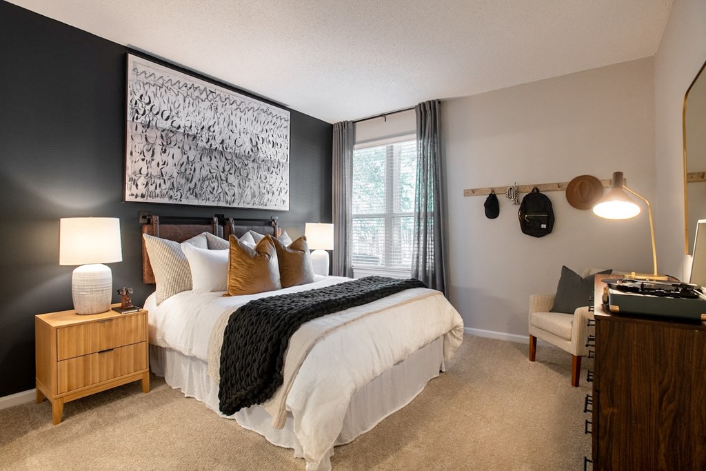an attic bedroom with a bed and a window