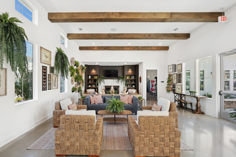 a living room filled with furniture and a large fireplace