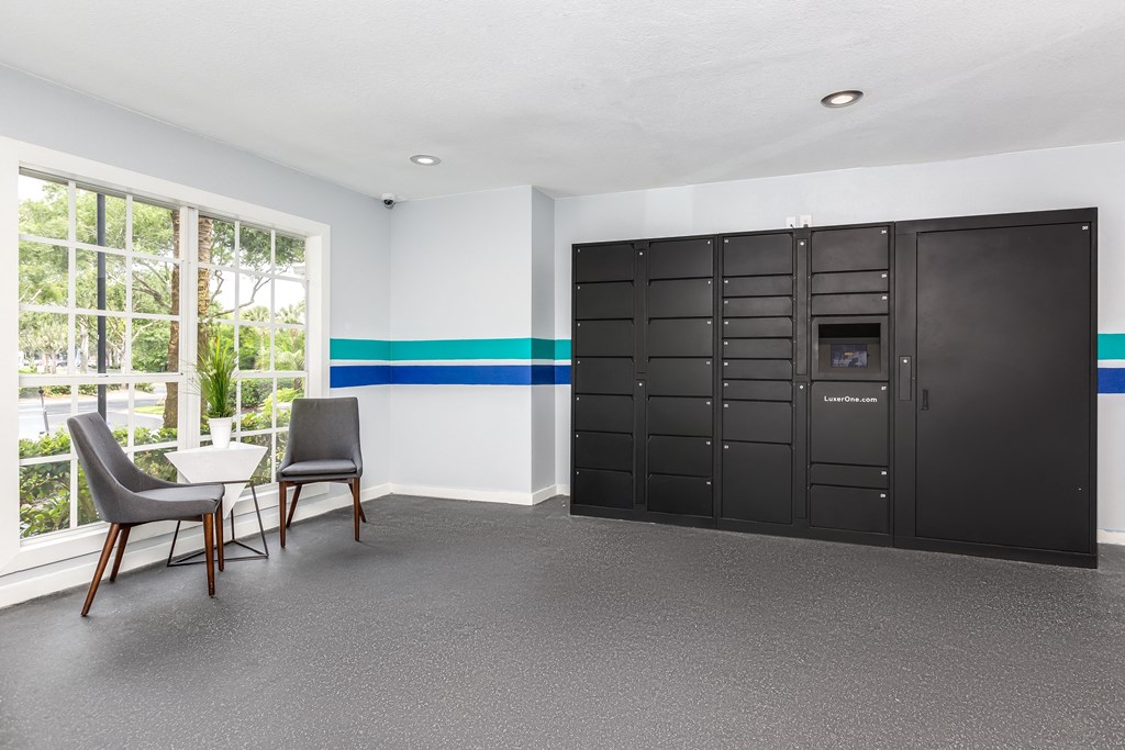 a room with two lockers and a table and chairs