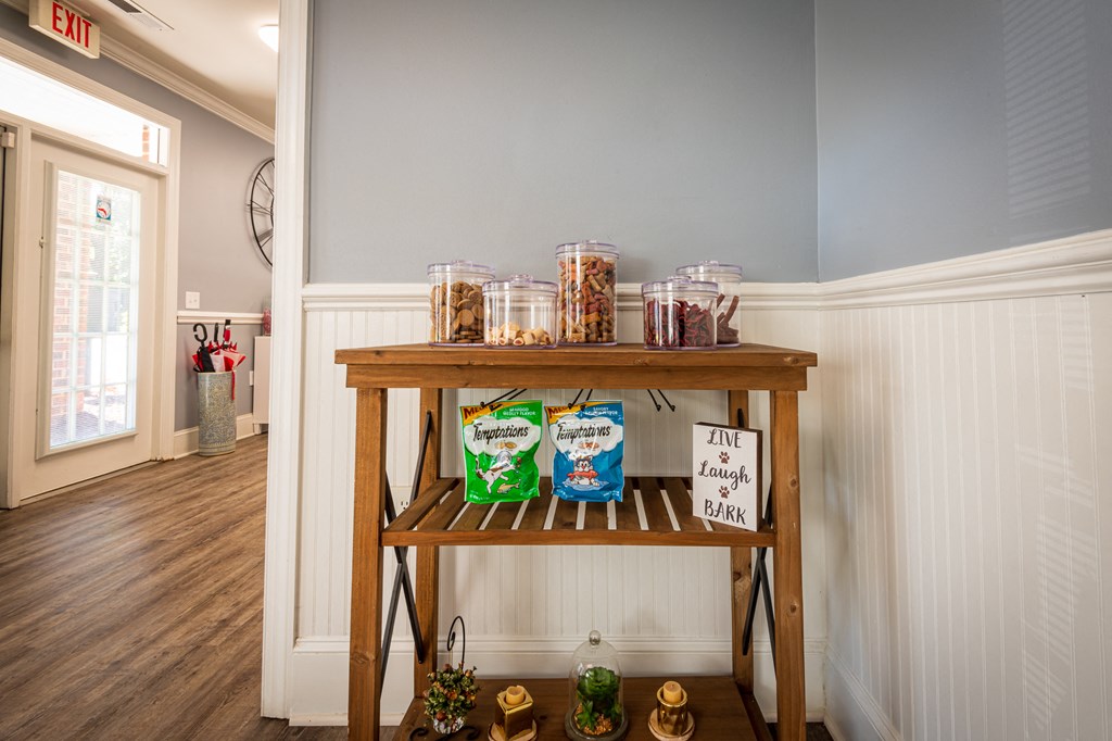 a table with jars of food on it in a kitchen