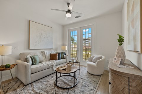 a living room with a couch and a chair