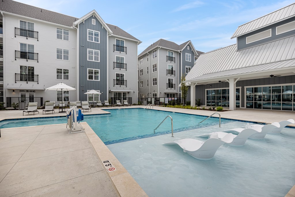 Swimming Pool with Loungers Inside the Pool.