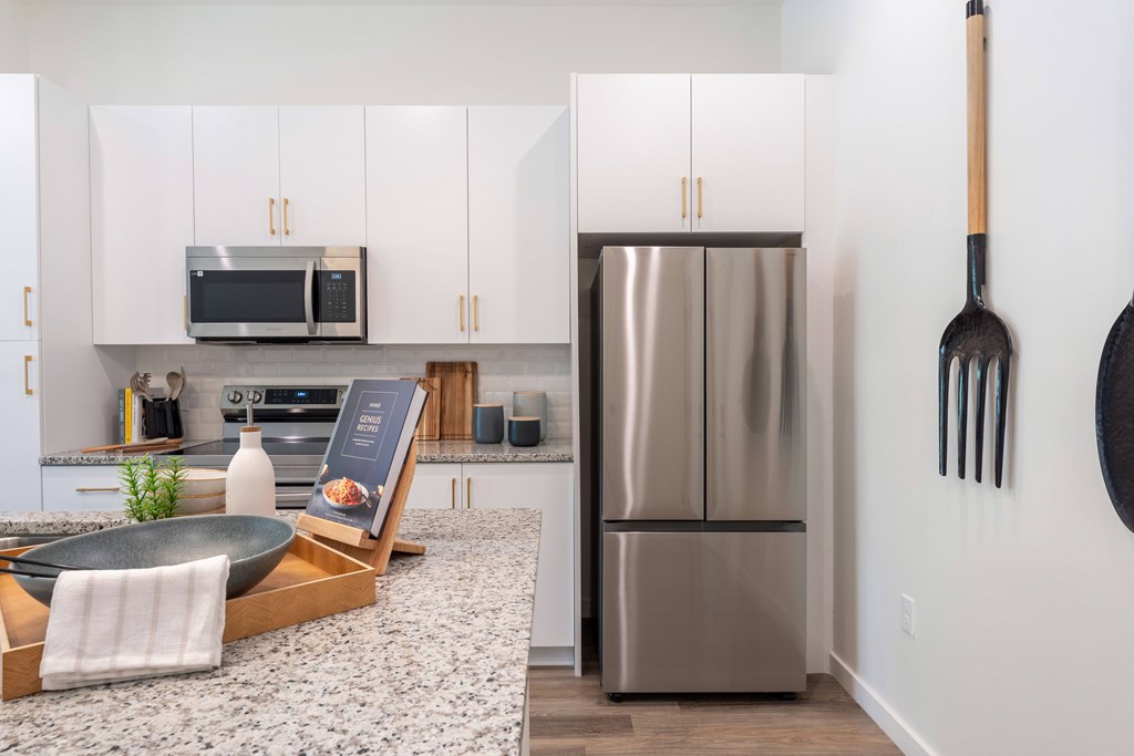 A modern kitchen with a stainless steel appliances