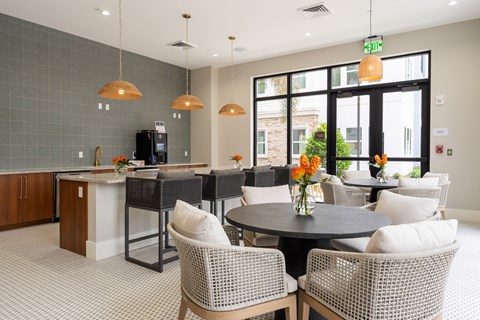 A modern dining area with a round table and chairs.