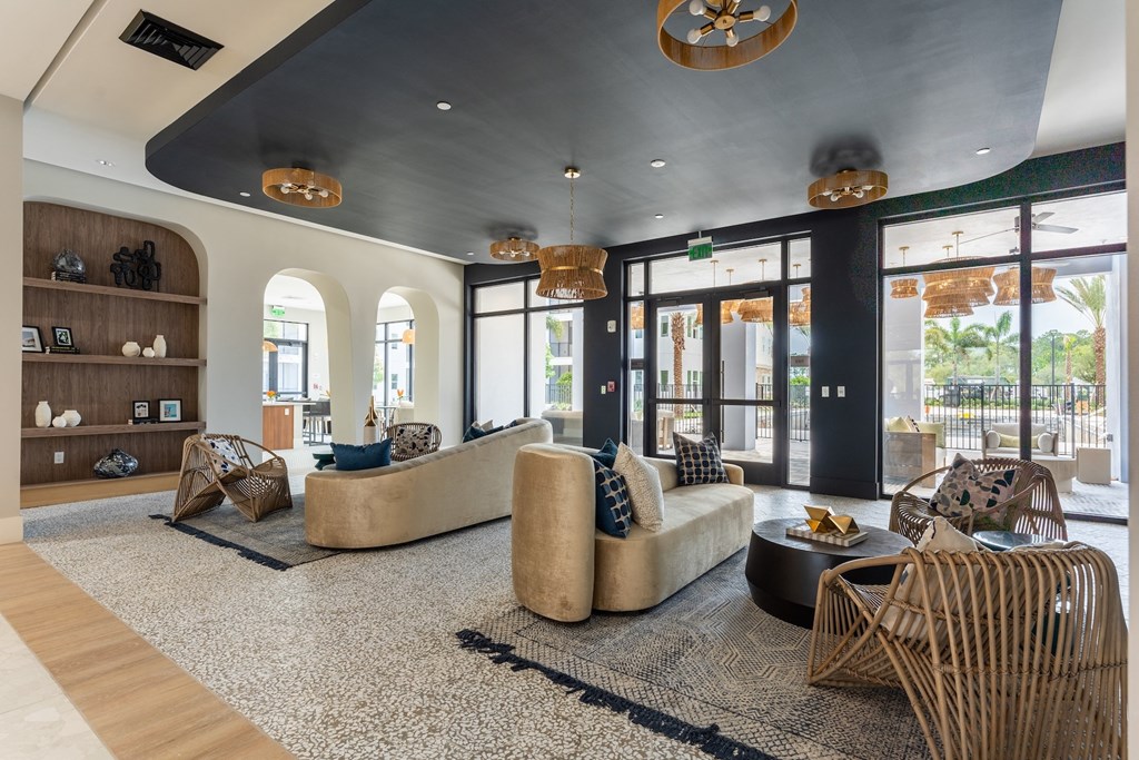 A living room with a large couch and a coffee table.