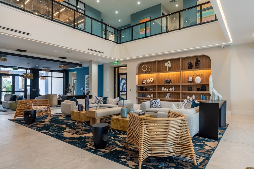 A large room with a lot of furniture and a balcony.