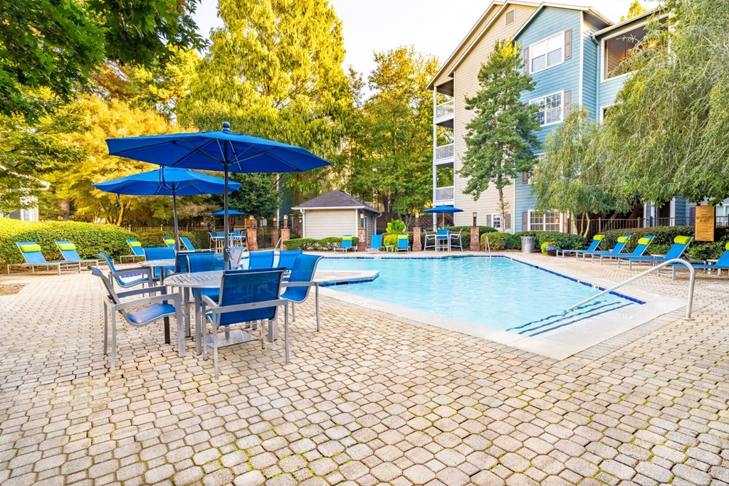 our apartments offer a swimming pool with chairs and umbrellas