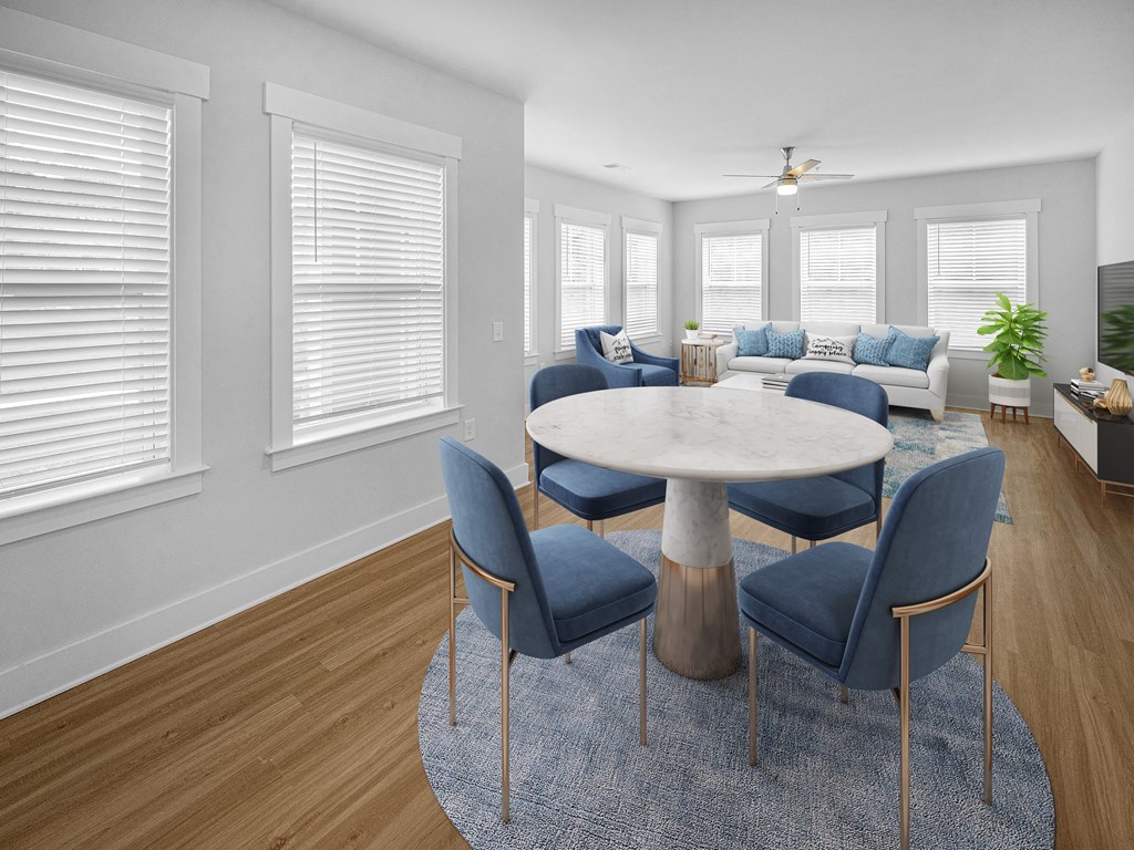 modern dining room and living room with many windows and natural light