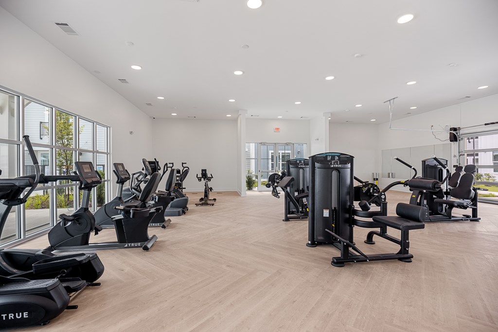 Gym with a Variety of Exercise Equipment All Lined Up.