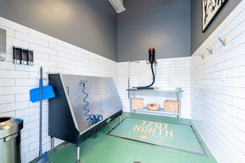 A bathroom with a green floor and a sign that says "NORTH".