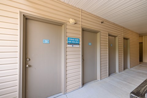 A hallway with doors labeled ZA, ZB, and ZC.