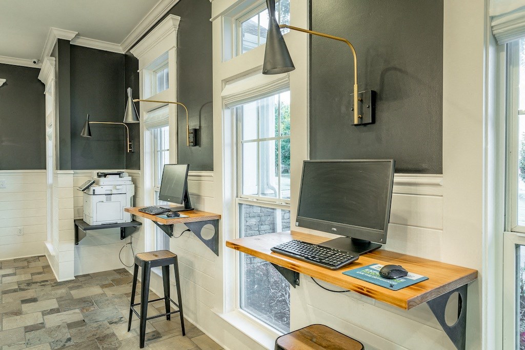 a home office with two desks and two computers