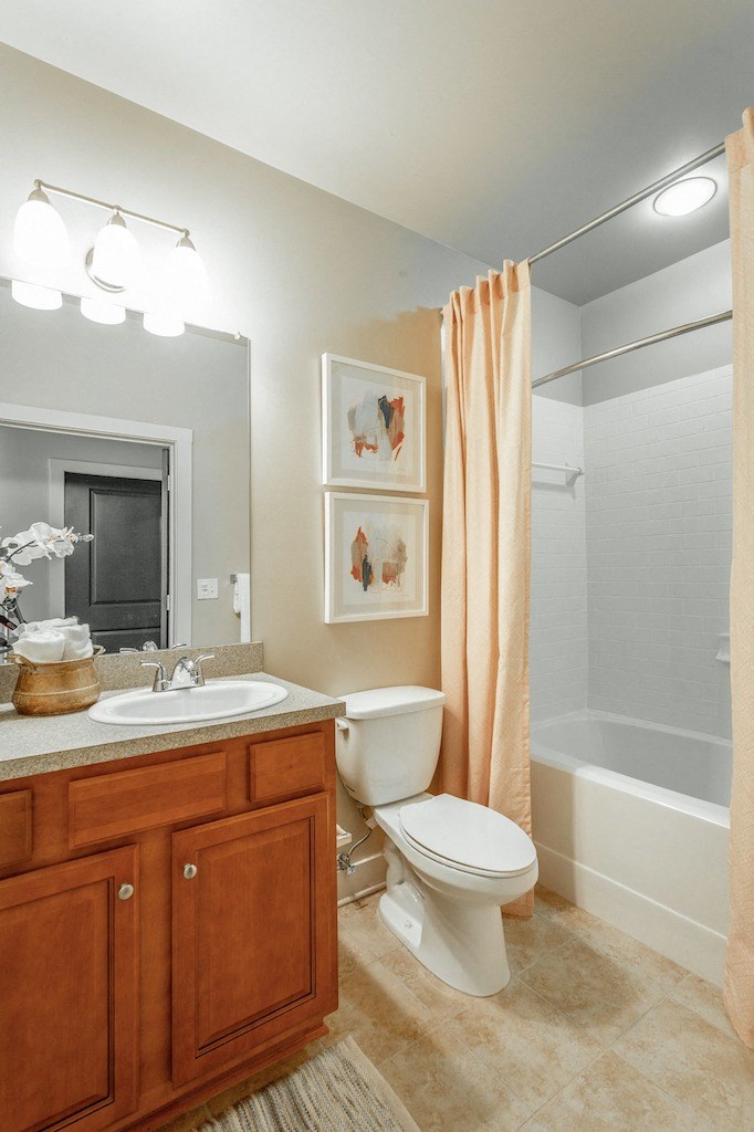 a bathroom with a toilet sink and bathtub