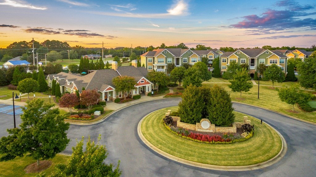 an aerial view of a neighborhood with houses and trees