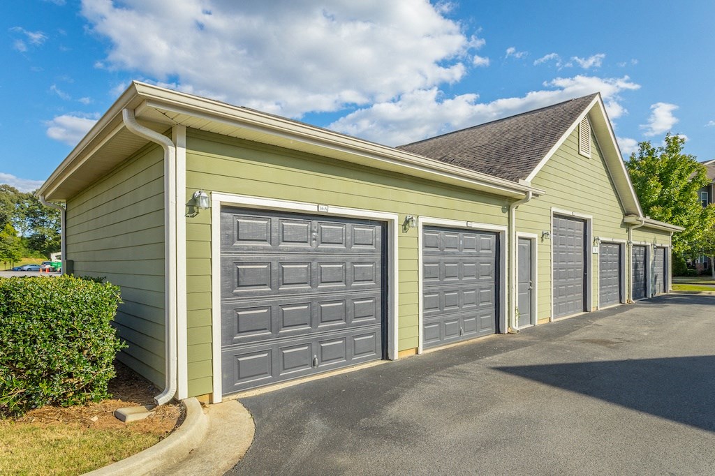 a row of garages in front of a house