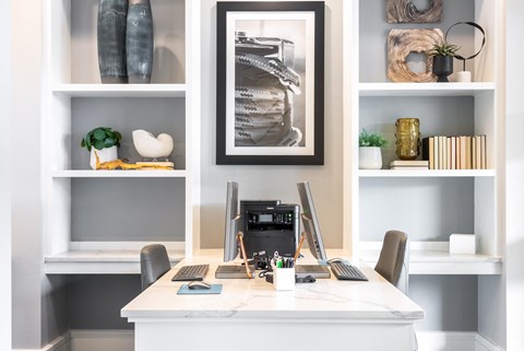 a home office with a desk and a computer