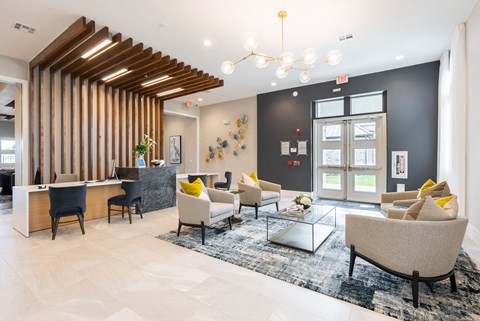 a lobby with couches and chairs and a table