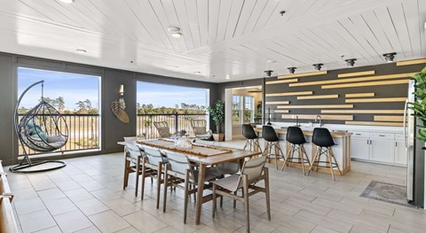 A modern dining room with a wooden table and chairs.