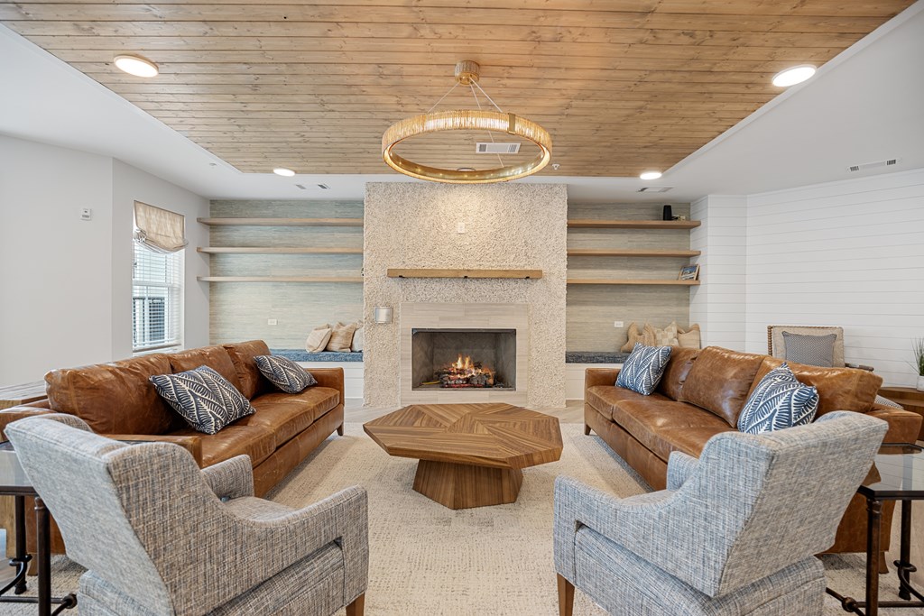 Clubhouse Living Room with a Fireplace and Two Couches for Seating.