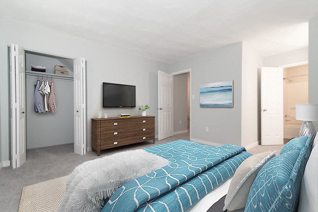 a bedroom with a bed and a dresser