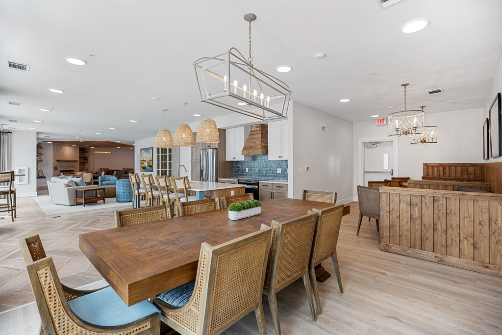 Clubhouse Modern Dining Room with a Large Wooden Table and Dining Chairs.