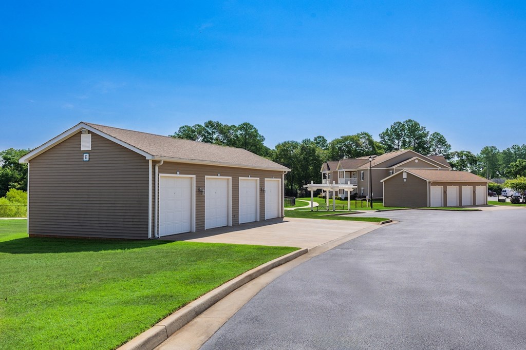 a street with houses and garages and a road