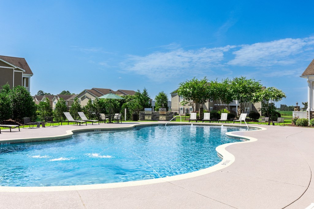 Amenities Highlight Outdoor Pavilion Featuring Grilling Stations and Seating Areas