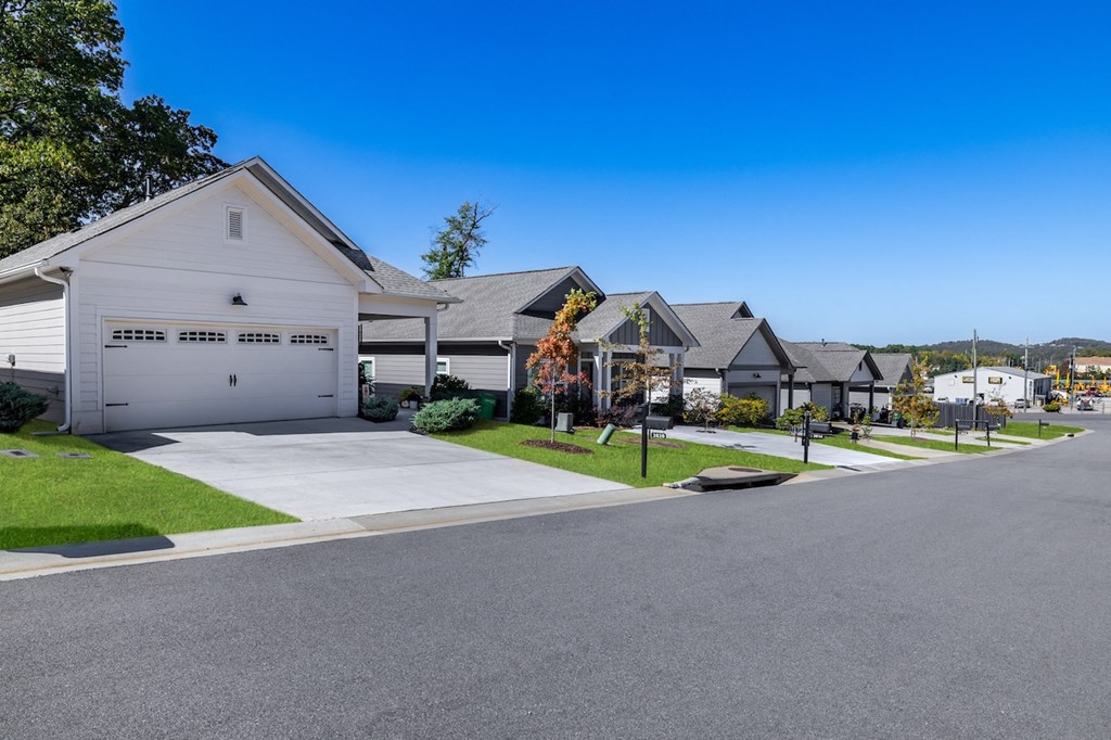 A row of houses with a clear blue sky above them.
