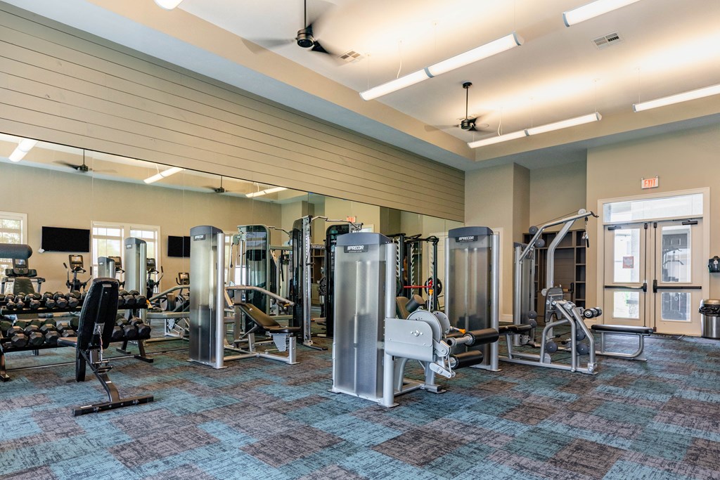 a gym with weights and cardio equipment at the preserve at greatstone