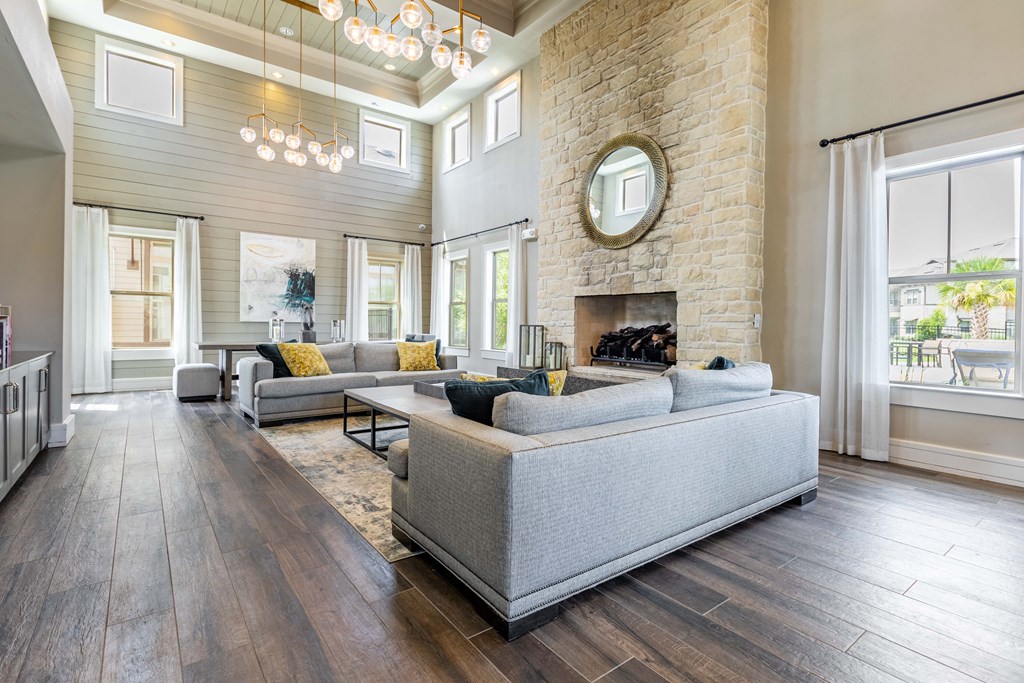 a living room with couches and a fireplace
