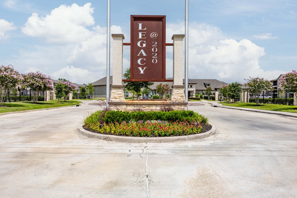 an empty street with a sign for the center