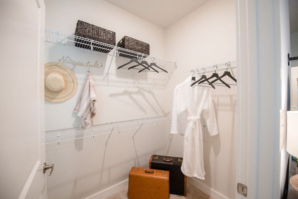 a walk in closet in a 555 waverly unit