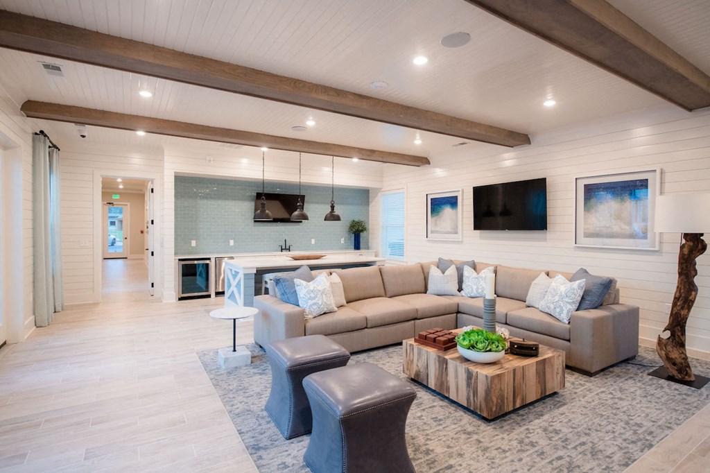 a living room filled with furniture and a large window